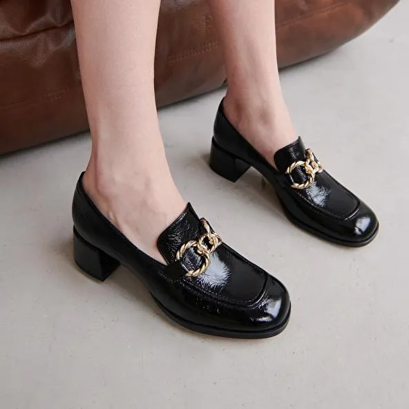 Mocassins à bouts arrondis et boucles dorées en cuir brillant noir