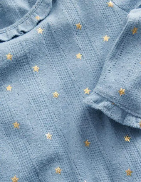 Top volanté scintillant en pointelle