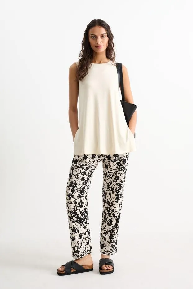 Cloth trousers - mid-rise waist - tapered fit - floral