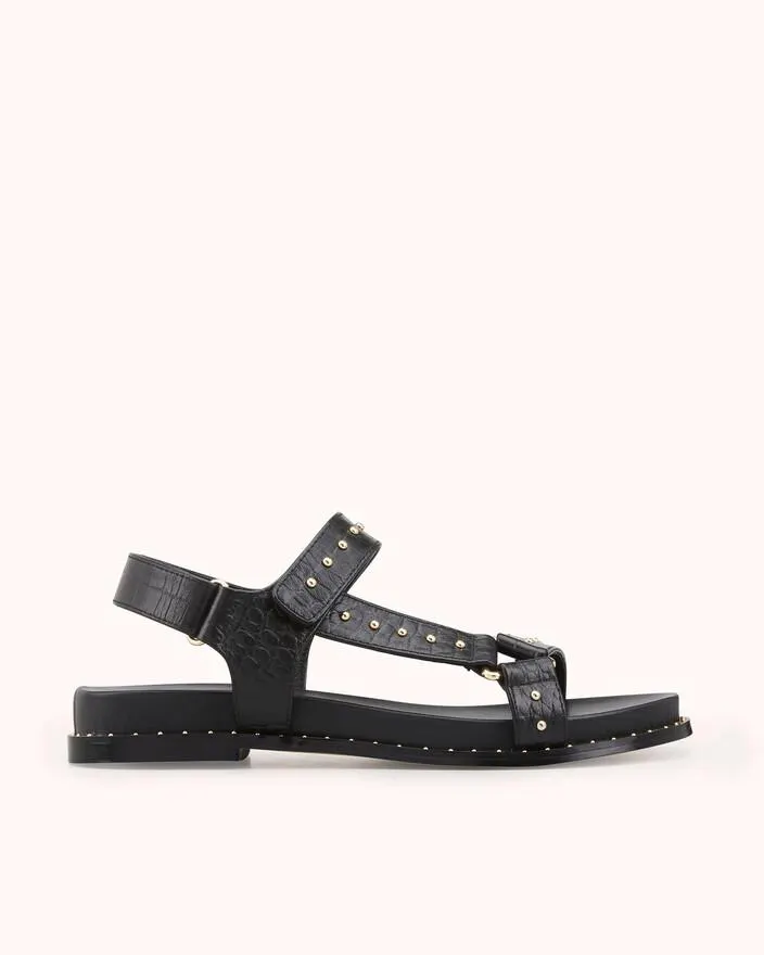 SANDALE PLATE HINES en cuir embossé croco noir