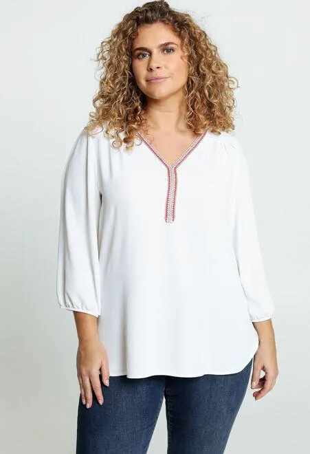 Blouse unie avec collier en lurex