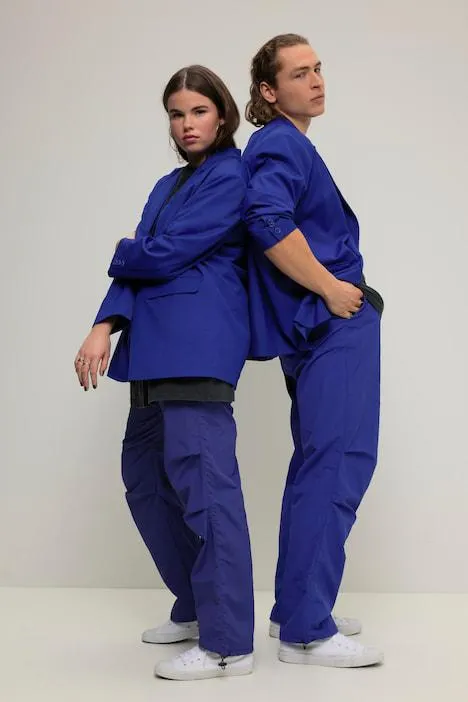 Blazer oversized unisexe à manches longues. Revers. Patte de boutonnage dans le dos