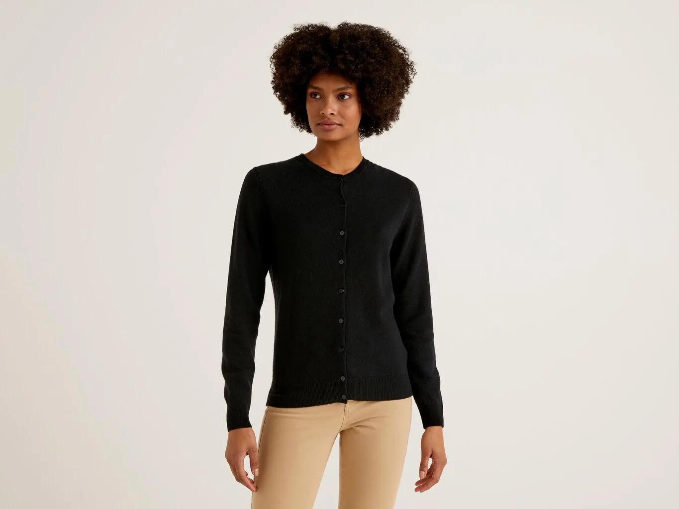 Cardigan girocollo nero in pura lana Merino