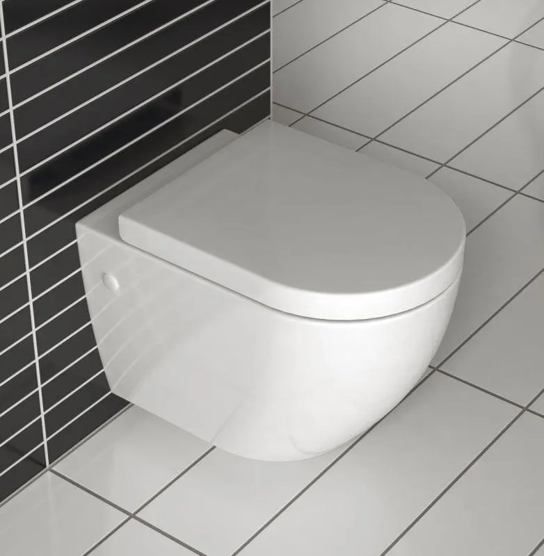 REA Carlo Rimless Slim mini WC-istuin, jossa hitaasti sulkeutuva kansi