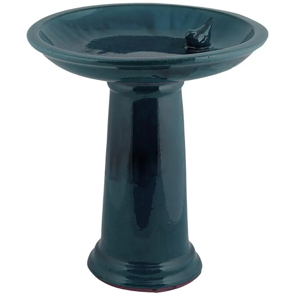 Ceramic bird bath on pedestal