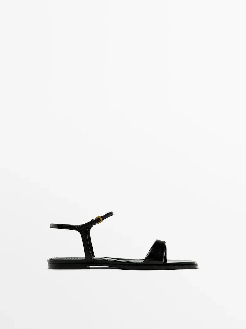 Flat creased patent finish sandals