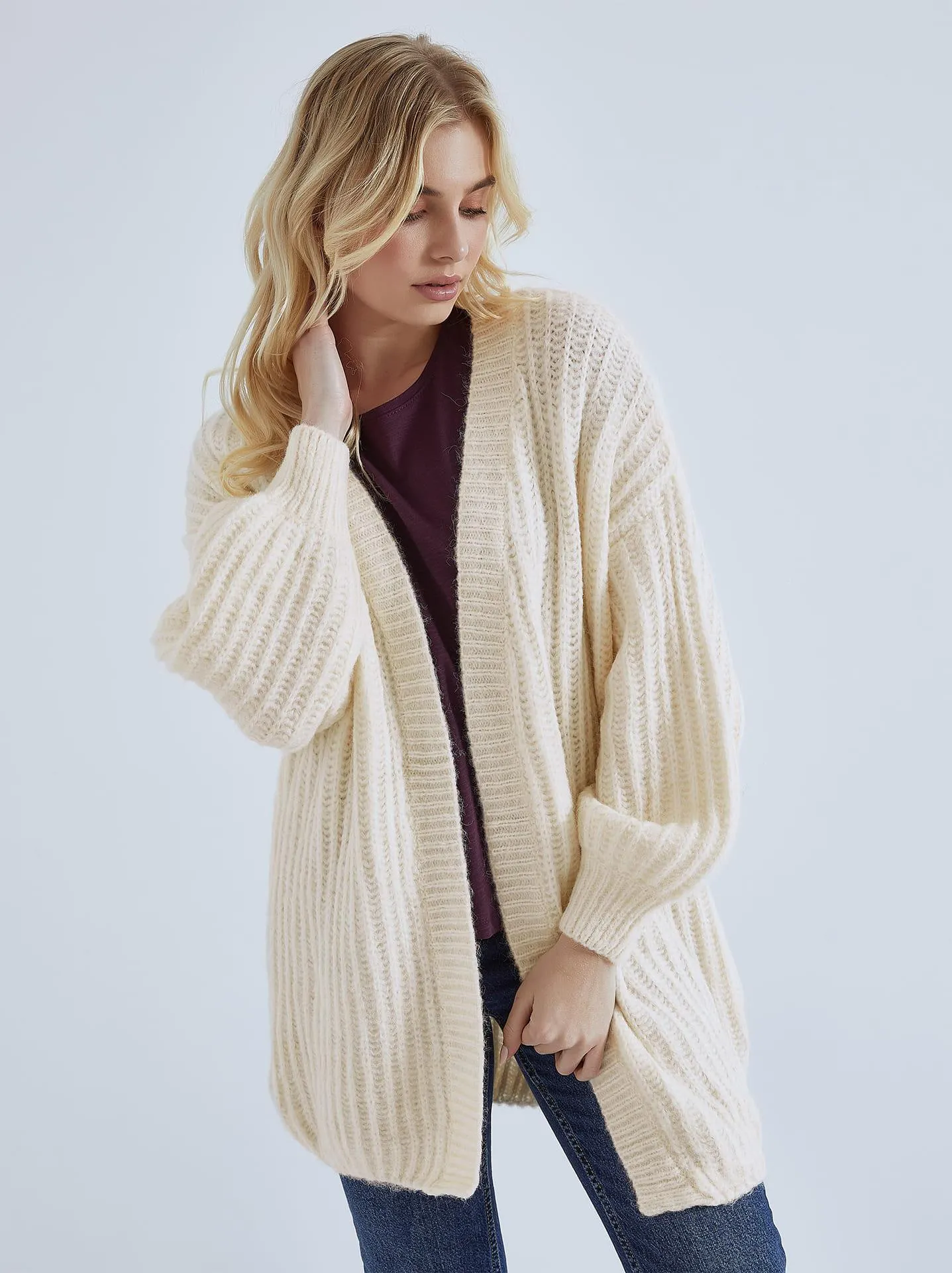 Πλεκτή ζακέτα με balloon μανίκι σε μπεζ ανοιχτό