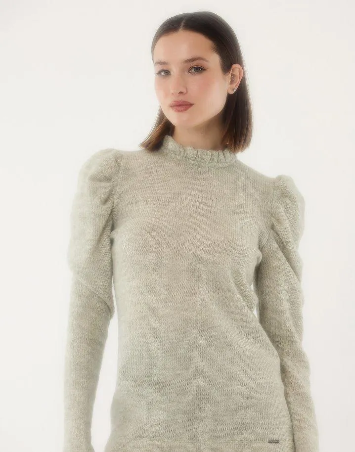 Πλεκτή μπλούζα με βολάν