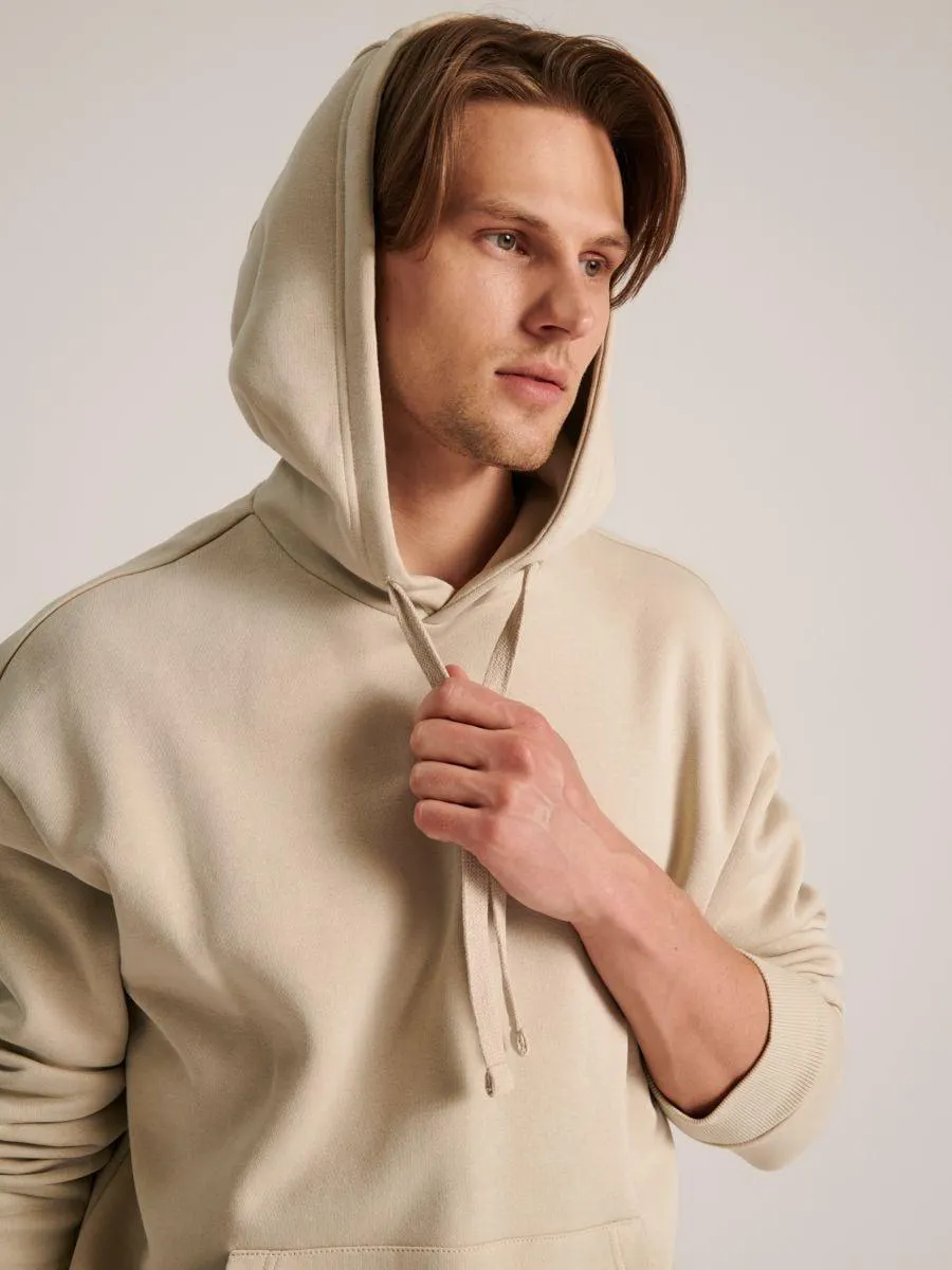 Kapucnis felső kenguruzsebbel