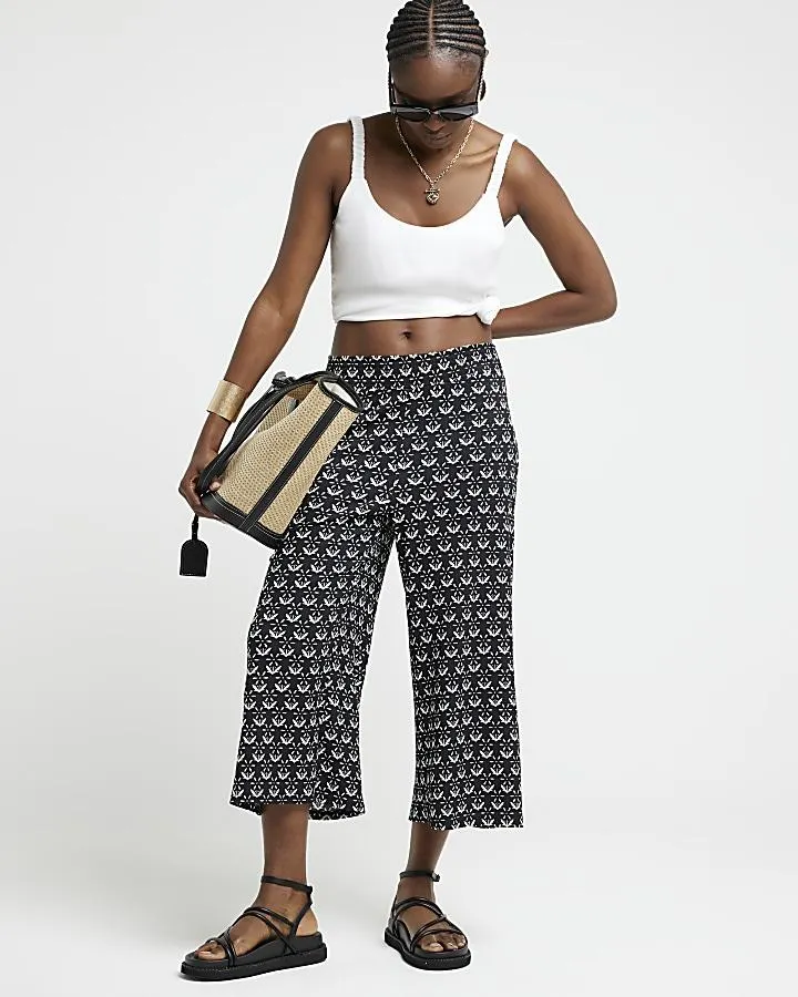 Black floral crop wide leg trousers