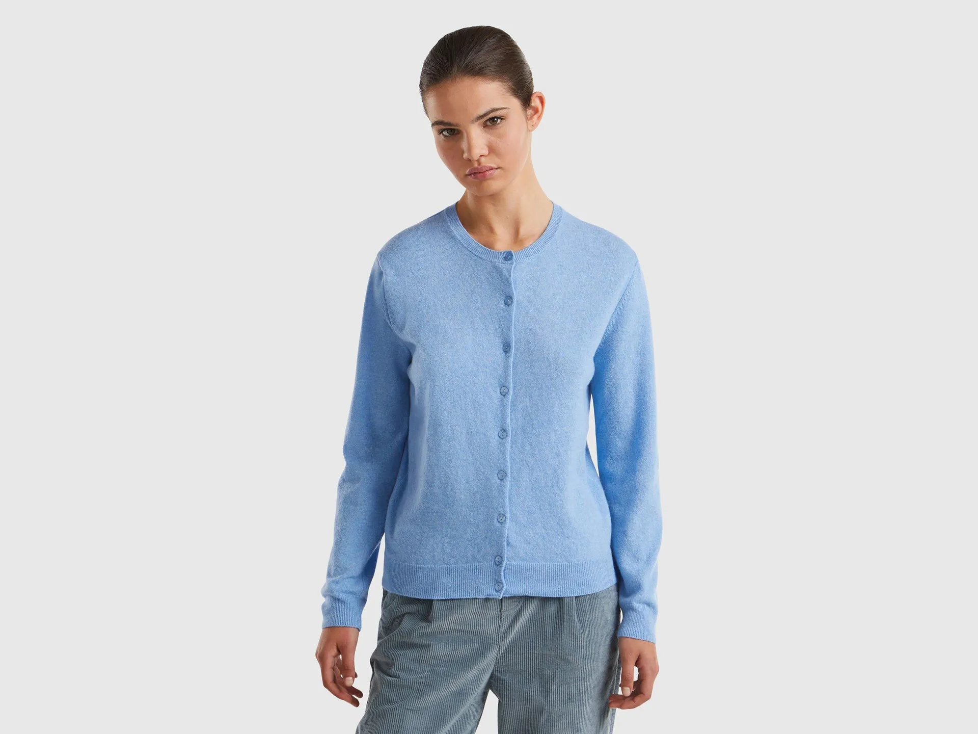 Cardigan girocollo azzurro in pura lana Merino