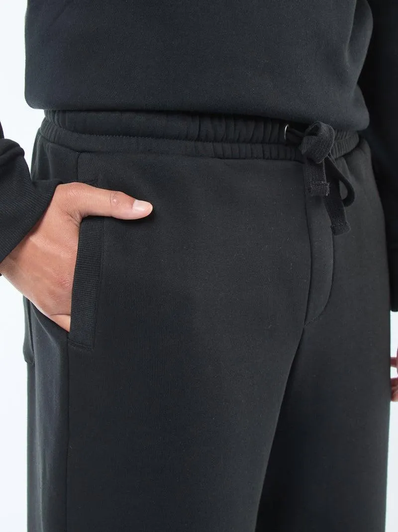 Pantaloni joggers tinta unita con cordoncini da stringere in vita - nero