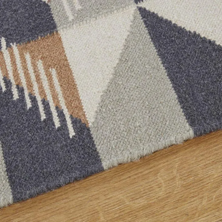 Tappeto in lana con motivi grafici multicolore 140x200 cm