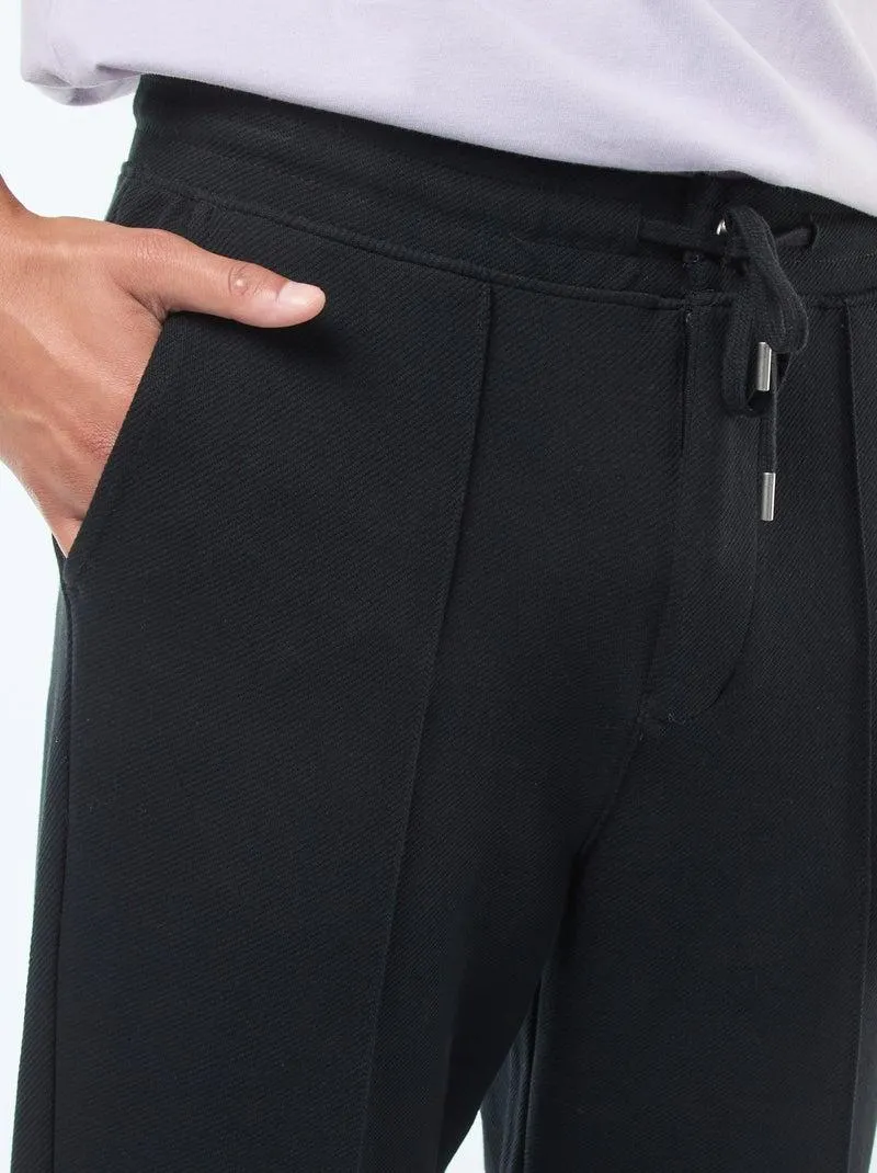 Joggers in maglia piqué tinta unita - nero