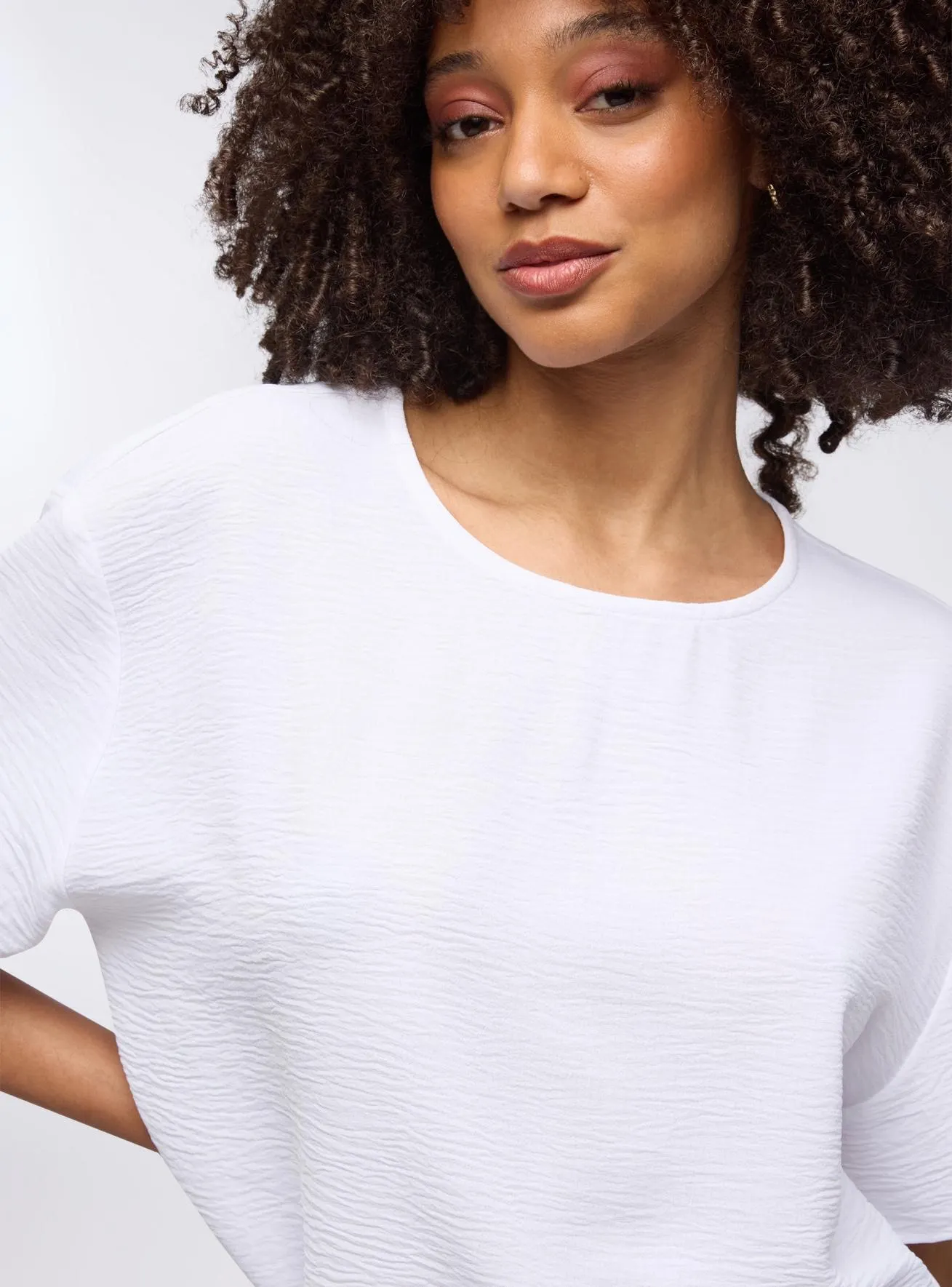 Blusa tinta unita a maniche corte Bianco ottico