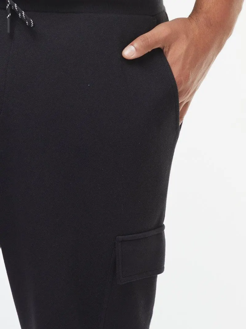 Joggers in maglia piqué con tasche con patta - nero