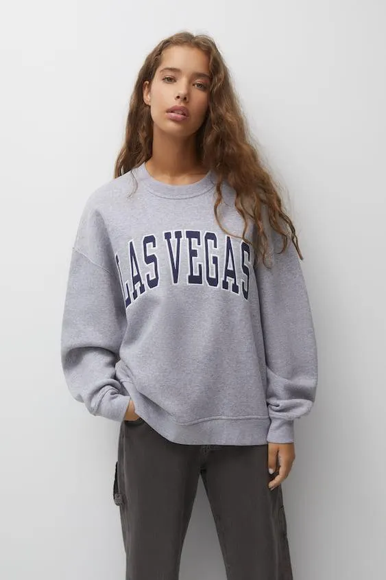 FELPA CON RICAMO E TOPPA