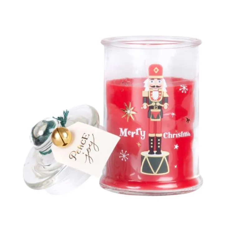 Candela profumata in vetro con stampa schiaccianoci rossa, dorata e bianca 100g