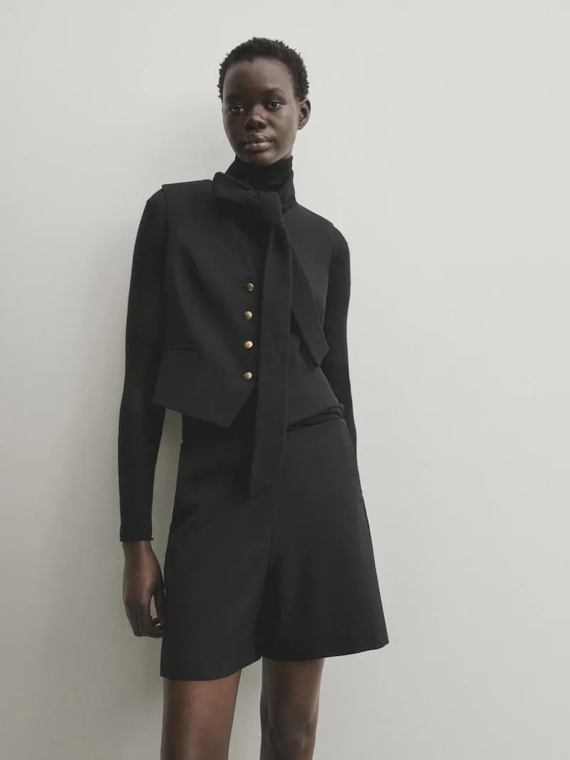 Chaleco corto botones dorados