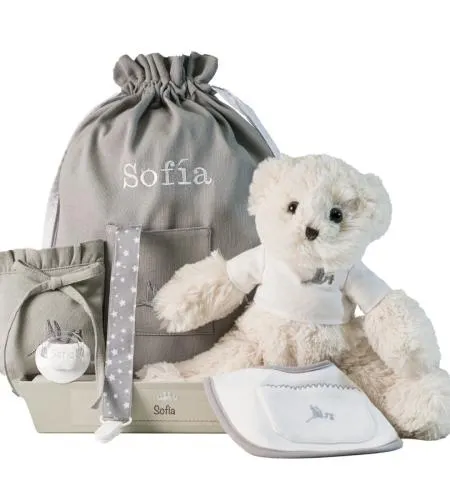 Cesta con chupón personalizado y complementos para recién nacido