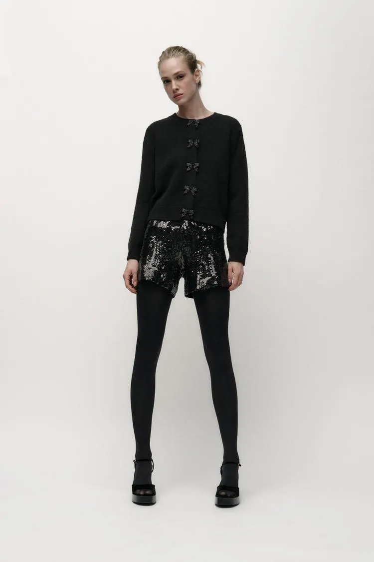 SUÉTER PUNTO BOTONES LAZOS