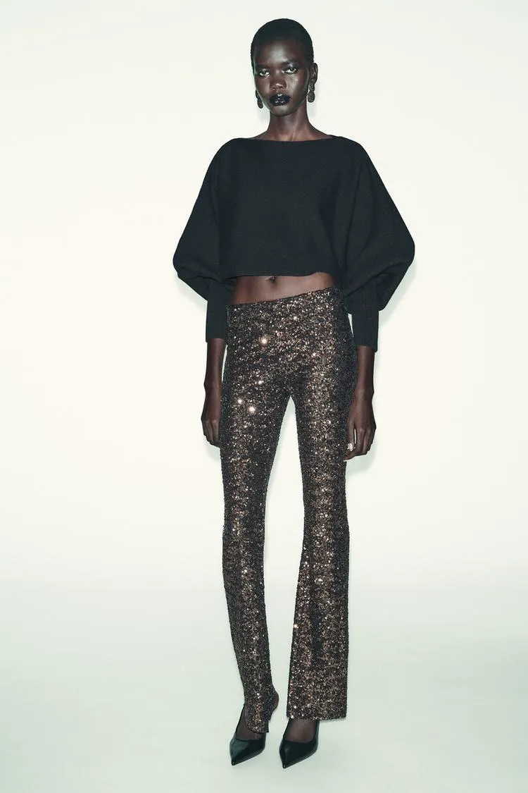 SUÉTER CORTO PUNTO MANGA ABULLONADA