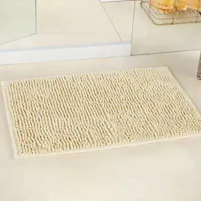 Tapete beige para baño