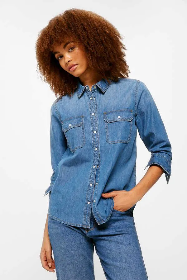 Blusa denim bolsillos sobre