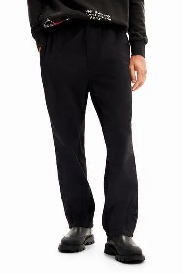 Pantalón híbrido pliegues