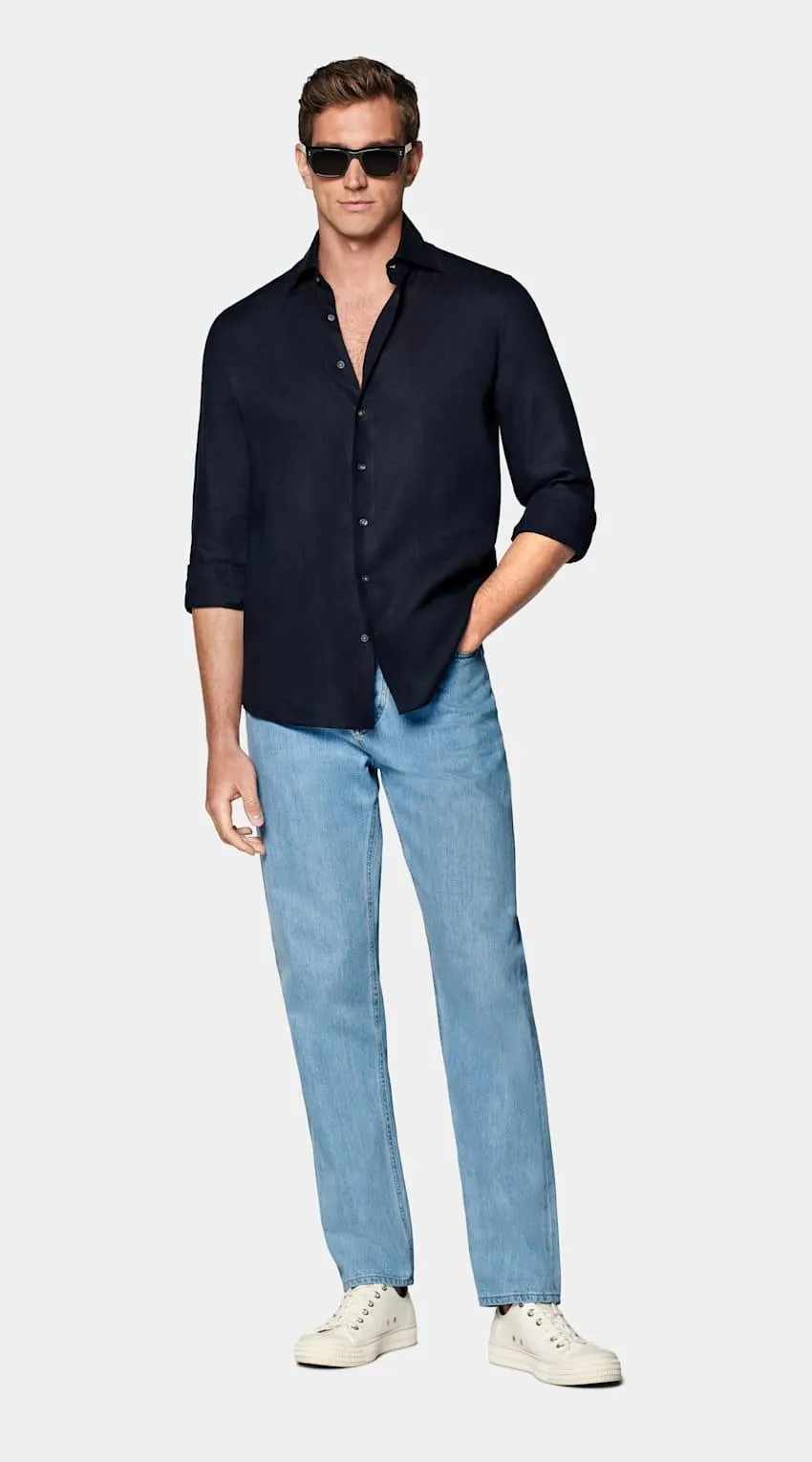 This casual navy slim fit shirt is cut to a shorter length for versatile styling, and crafted with ultra-fine stitching, heat-sealed buttons and classic widespread collar.