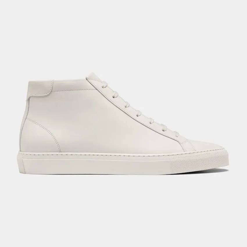A classic high-top design meets the luxury of Italian calf leather in these off-white Portuguese-made sneakers. Fully lined in light brown leather, they're the perfect pairing to any casual or elevated casual look.