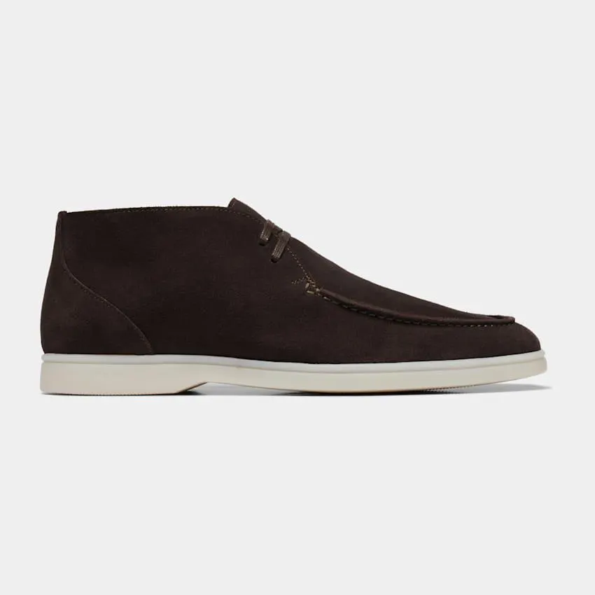 Seamlessly adapting to laid-back and elevated casual styles, these dark brown chukka boots are crafted in double-faced suede with an apron toe and slip-resistant rubber sole.