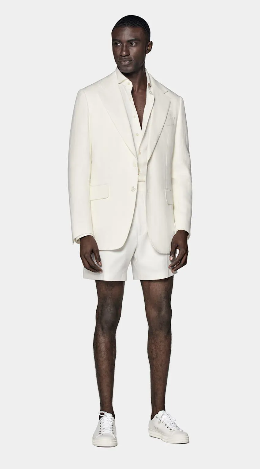 This chic off-white blazer is made to bring an unmistakable spring vibe. tailored slim with flap pockets, this classic piece is as refined as it is versatile.