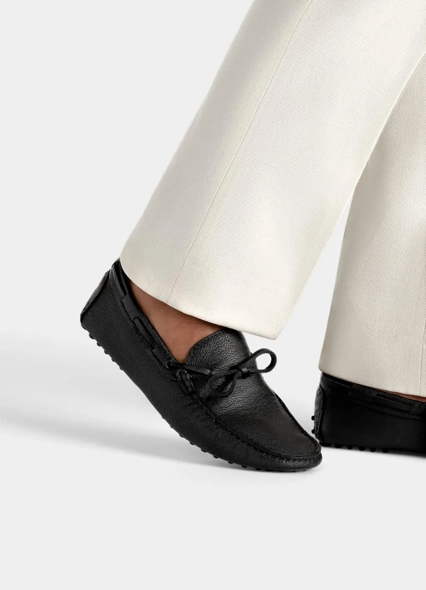 These textured black driving moccasins are crafted in Portugal from premium Italian calf leather, and feature tan leather lining, and rubber nub soles.