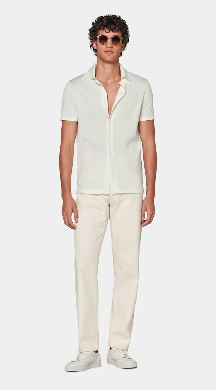 On its own or under a blazer, this beautiful knitted white polo cardigan is tailored to a slim fit and features a full placket.