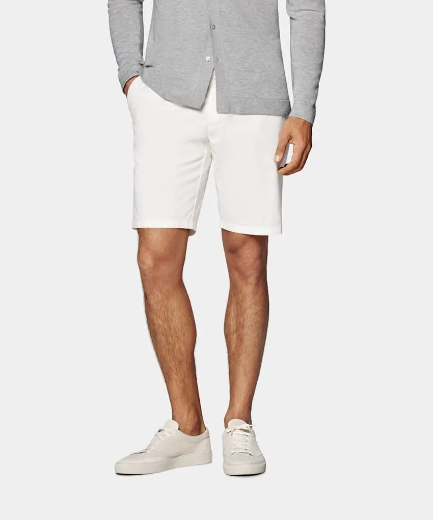 Elevate your warm-weather wardrobe with these off-white shorts, featuring a sleek, tailored fit and a clean flat-front design for versatile styling.