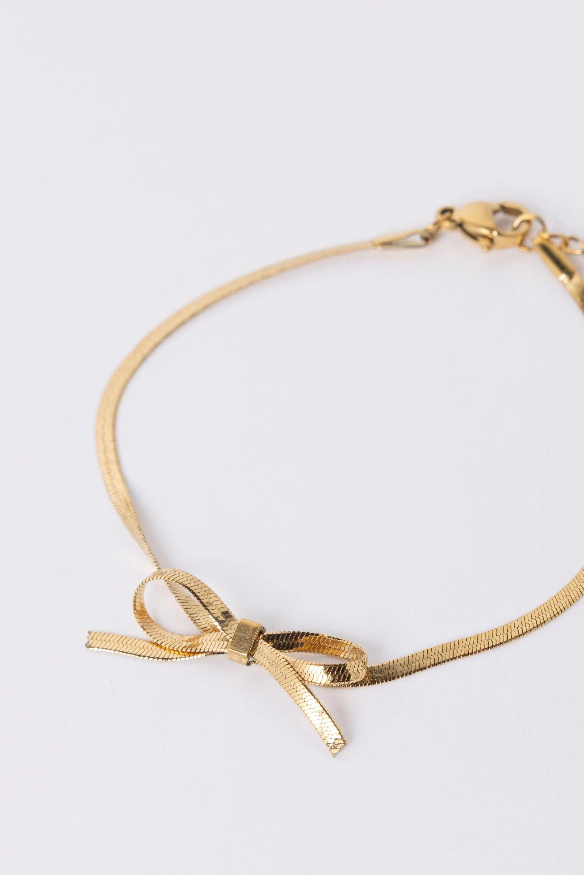 Goudkleurige armband met strikje