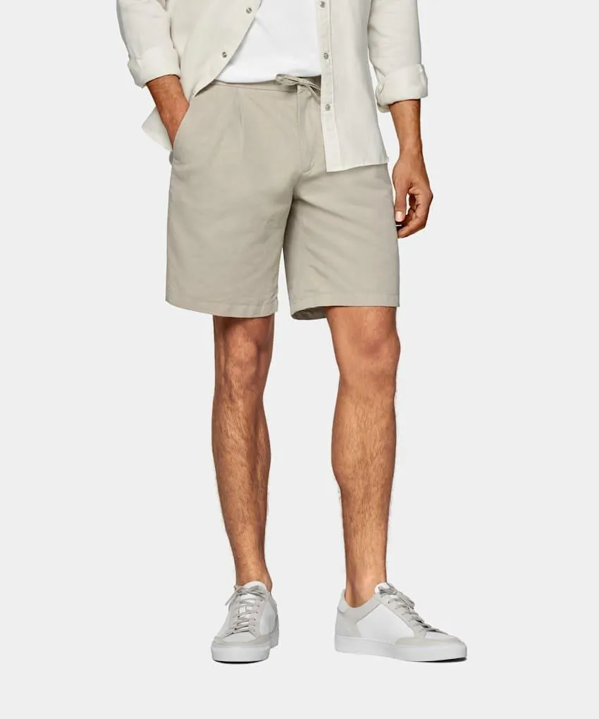 Characterized by double pleats, an elastic waistband, and drawstring closure, the new Aveiro shorts are cut just above the knee for a distinctively easygoing, vintage-inspired appeal.
