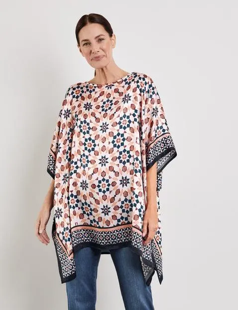 Jersey poncho met motief