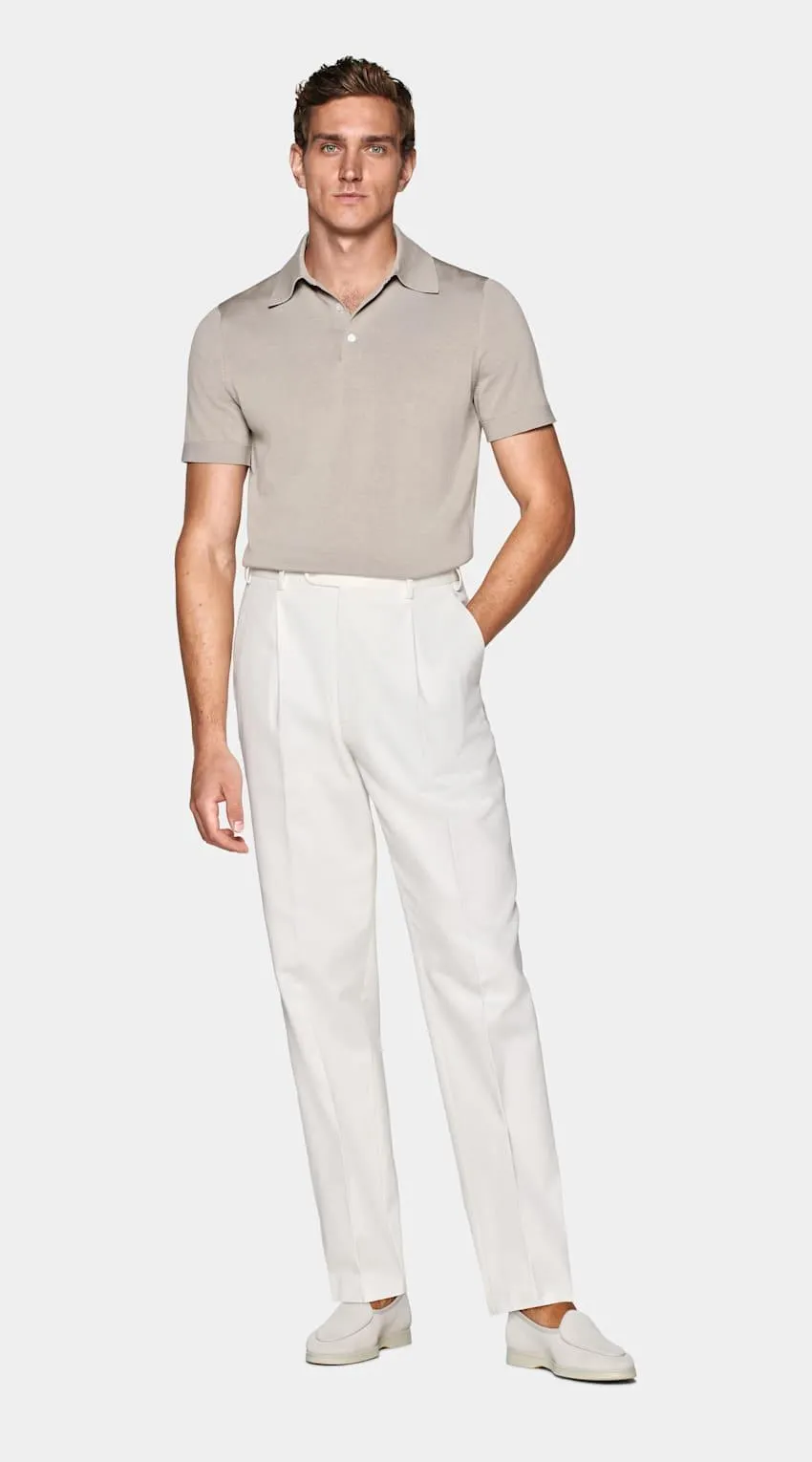 A casual classic in a luxury fabric, this taupe polo is tailored slim with a mother of pearl button closure and subtly ribbed hem and cuffs.