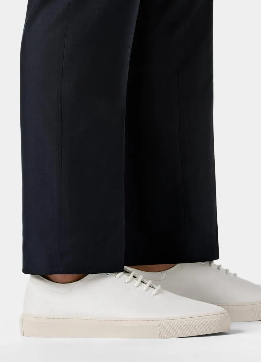 These crisp white sneakers are crafted in Portugal from textured cotton with a padded heel and cemented rubber sole.