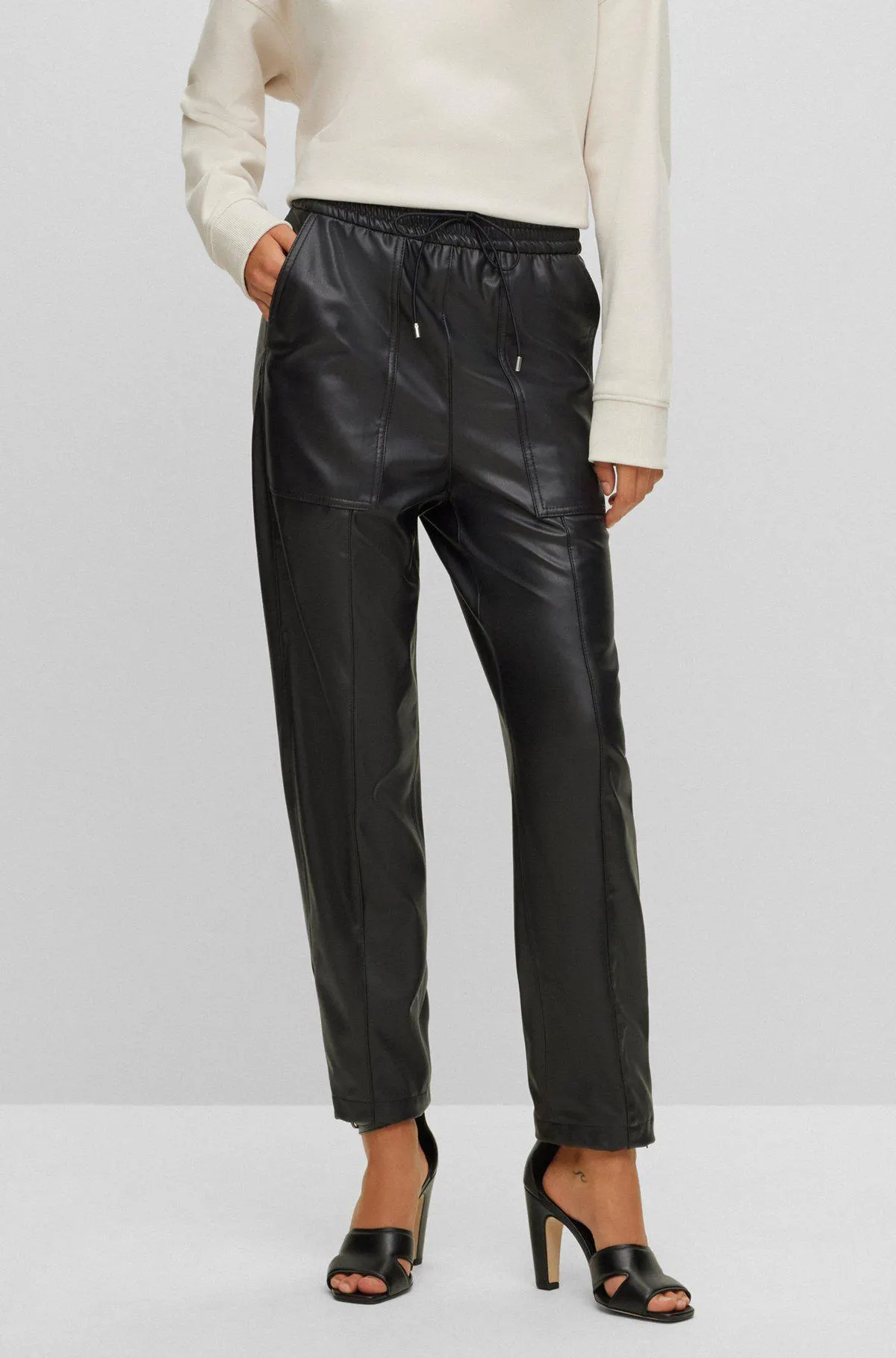 Relaxed-fit trousers in coated fabric with drawstring waist