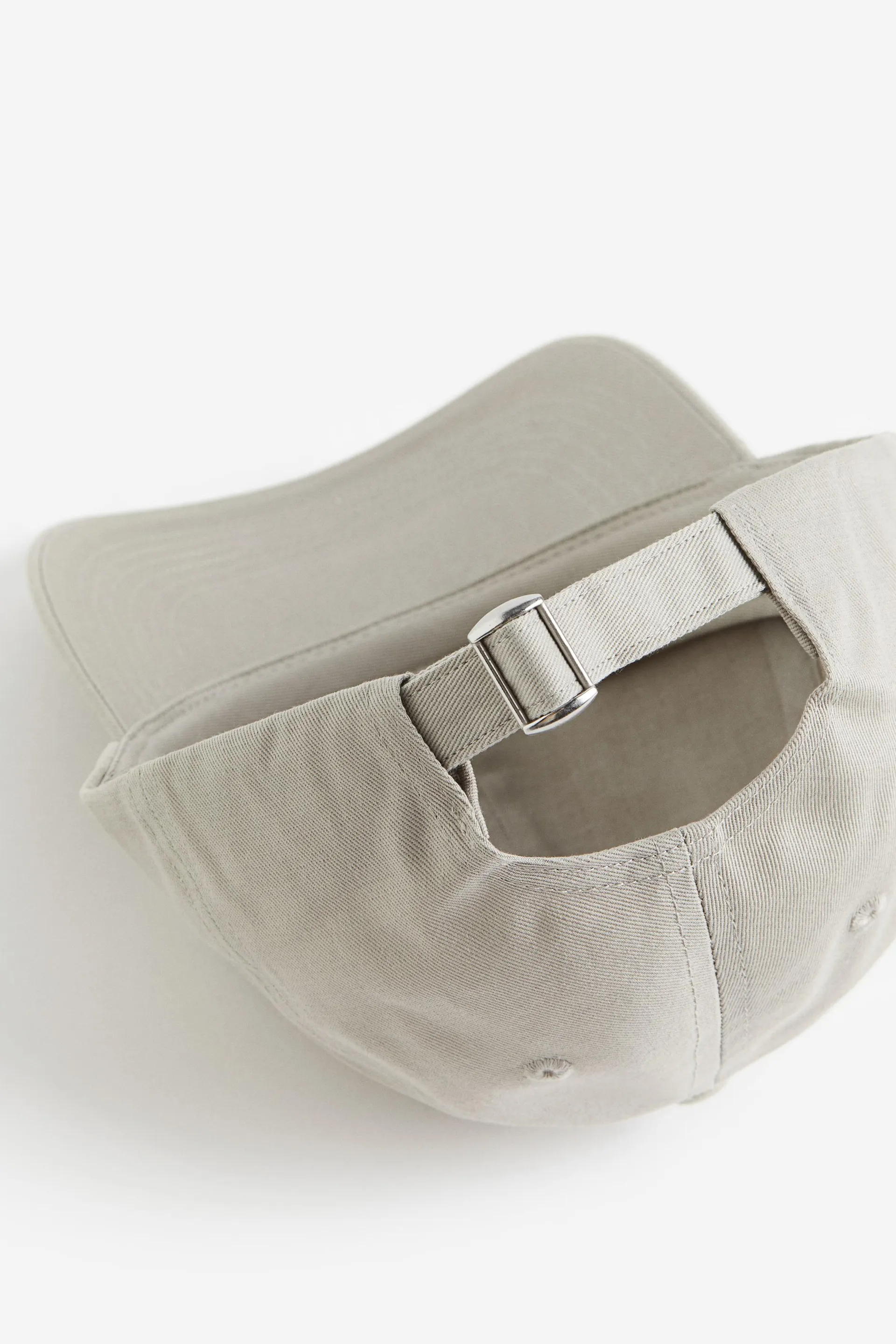 Caps i bomull med brodert motiv