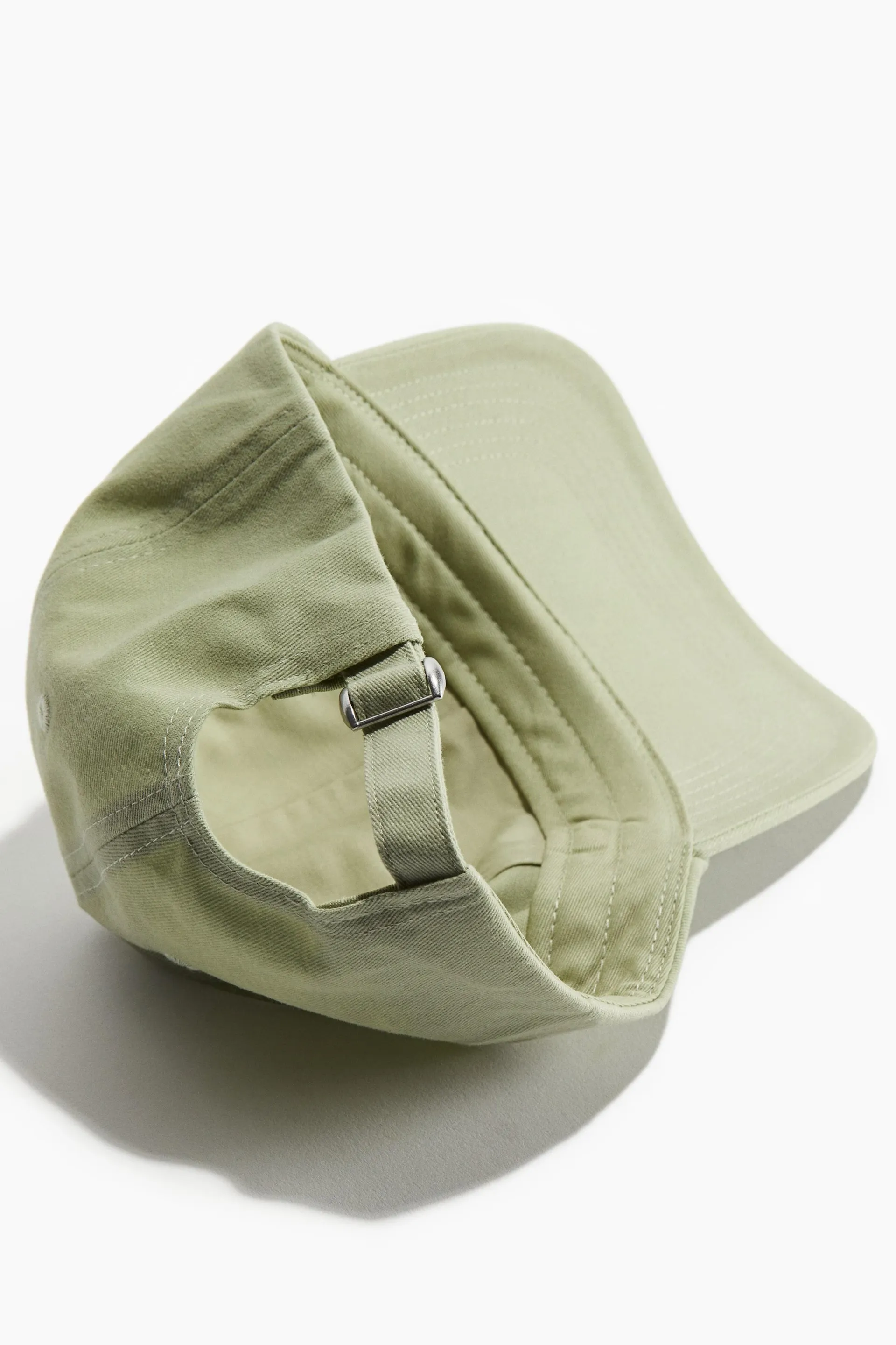 Caps i bomull med brodert motiv