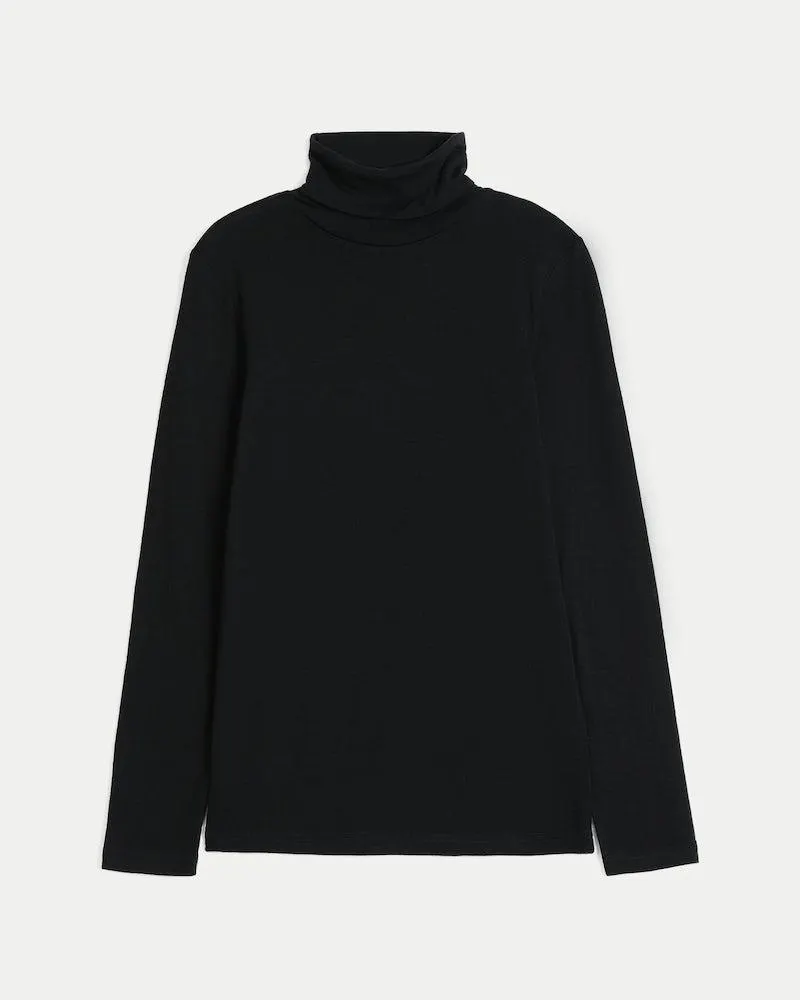 Langermet topp med høy hals i merinoull