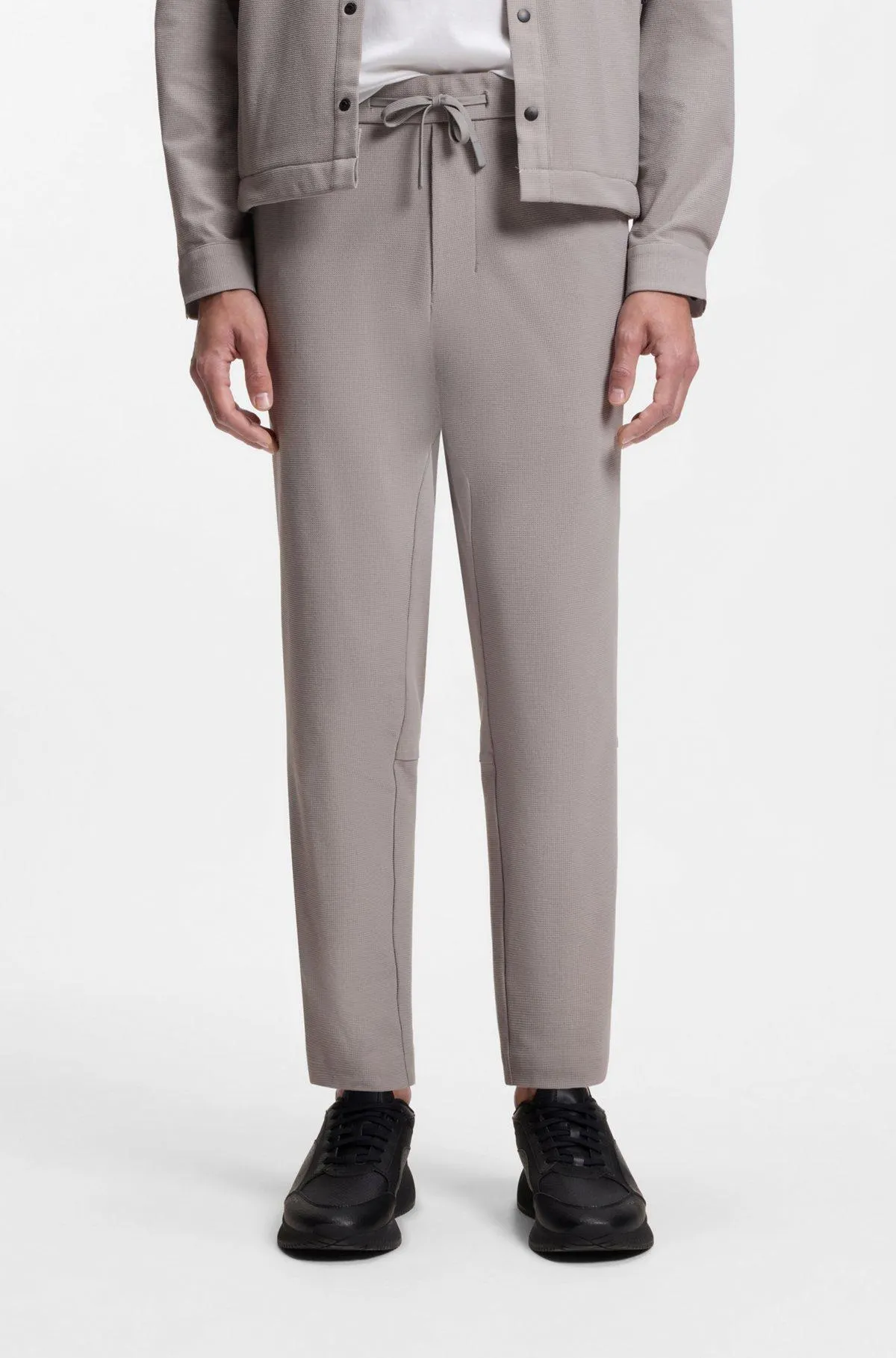Tapered-fit trousers in waffle-structured stretch fabric