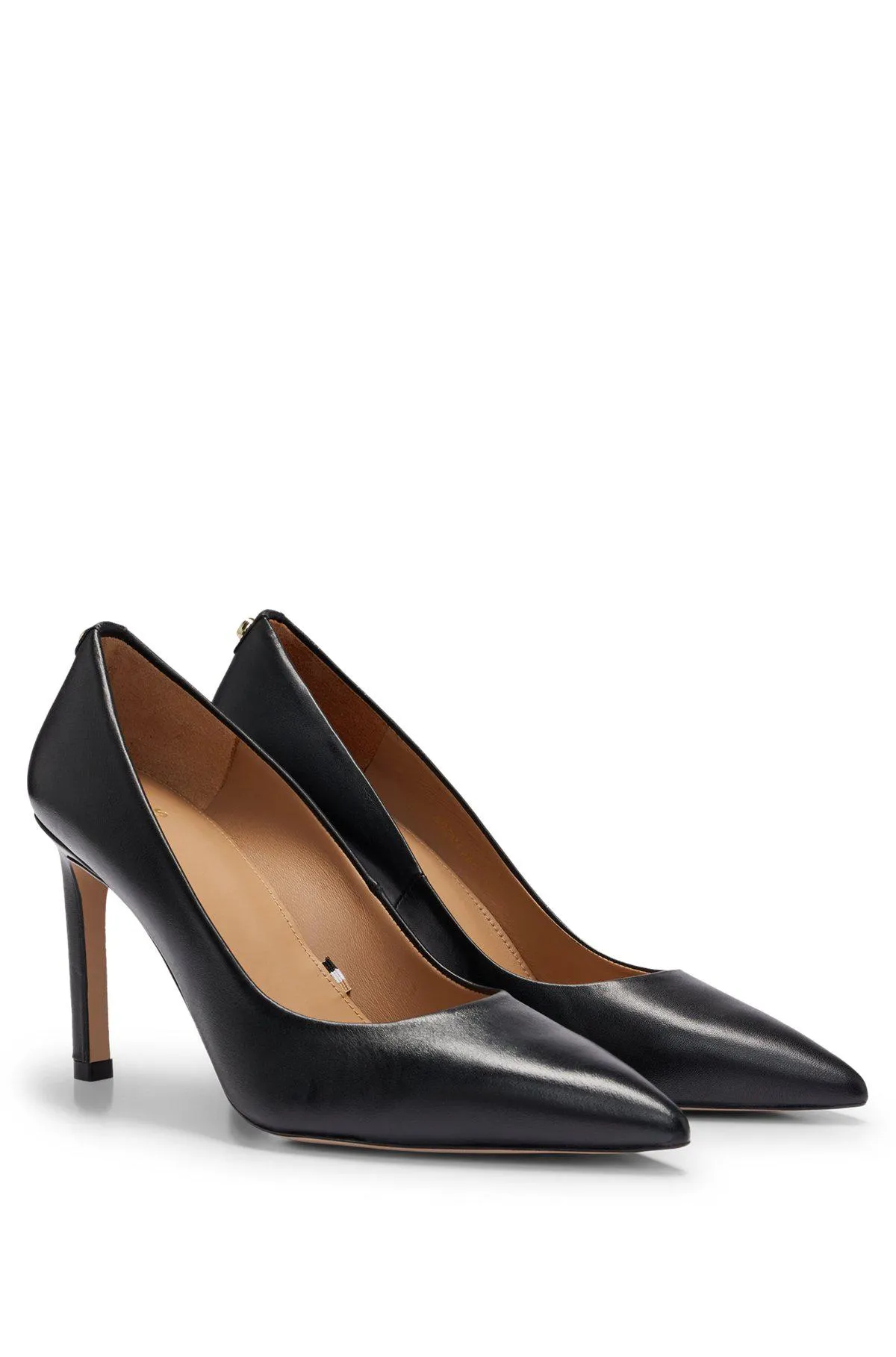 High-heeled pumps in leather with pointed toe
