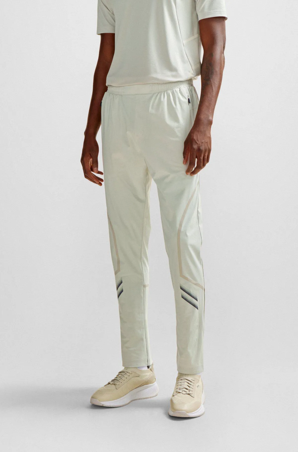 Regular-fit tracksuit bottoms with decorative reflective artwork