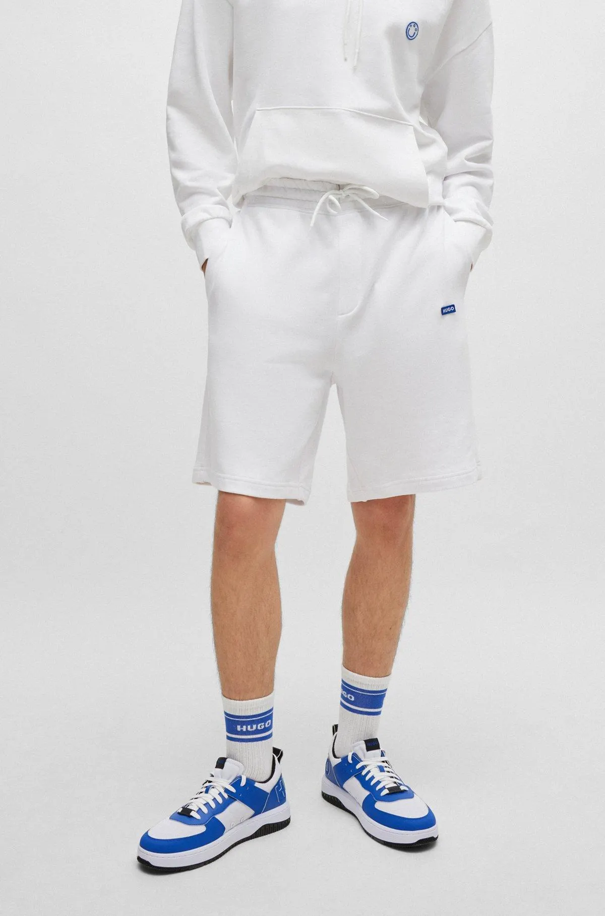 Cotton-terry shorts with blue logo patch