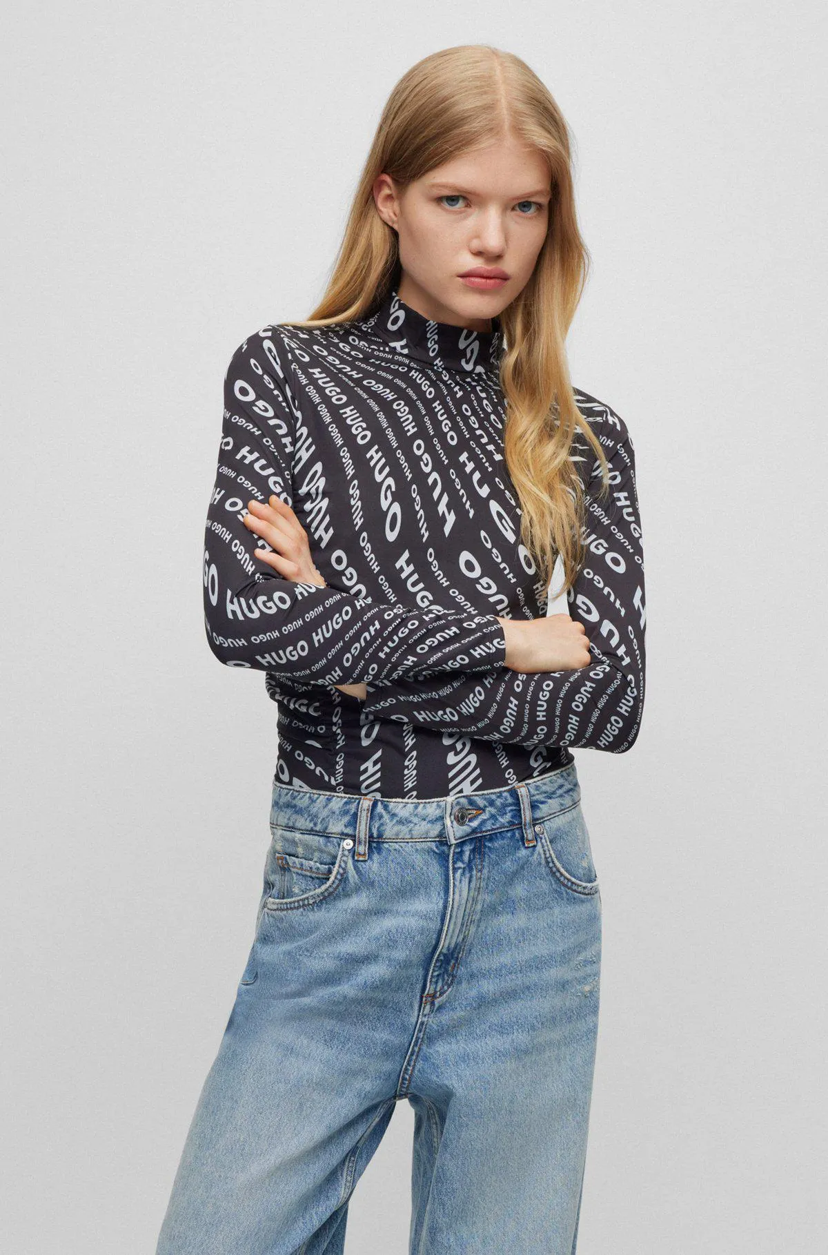 Mock-neck top with asymmetric ruffle detail